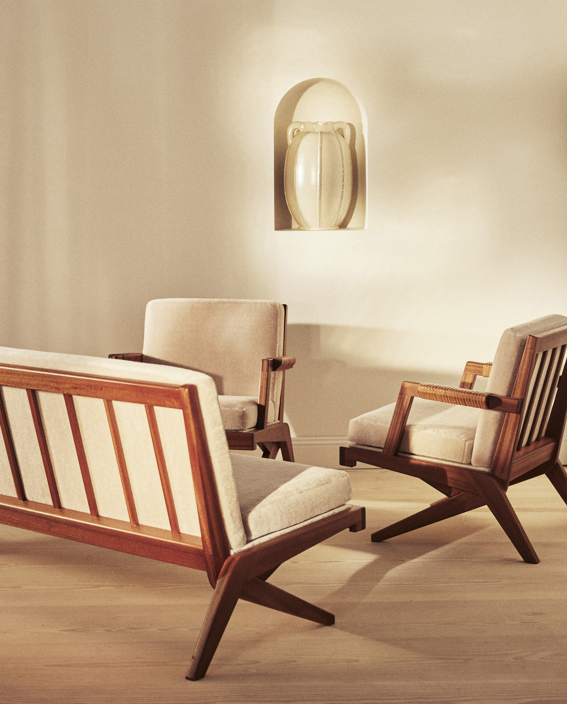 A suite of two armchairs and  sofa in grey velvet mohair fabric