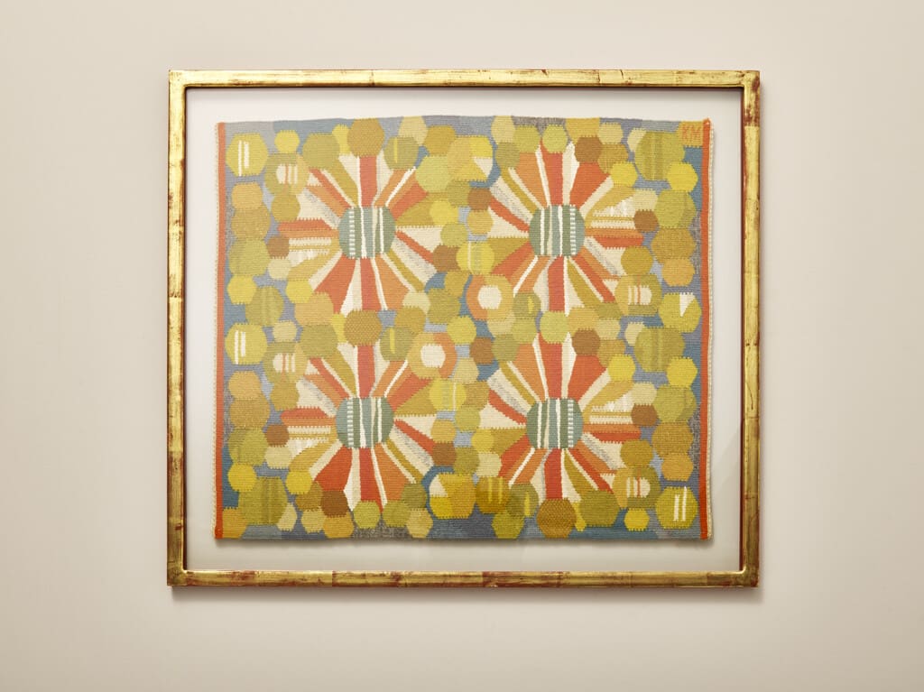 Framed textile with flower motif by Kajsa Melanton