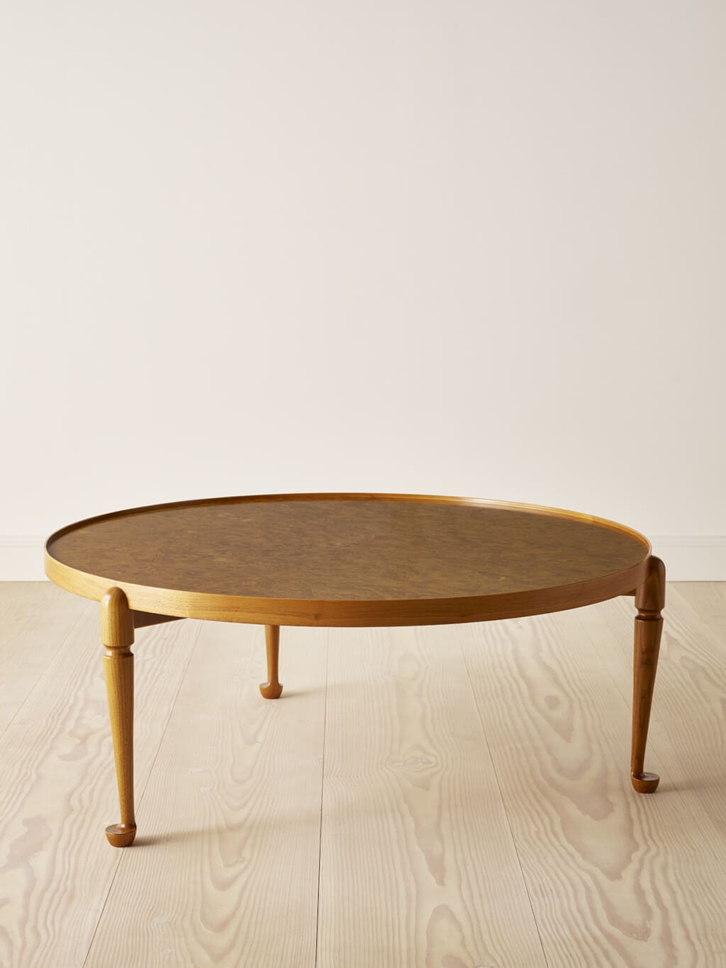 A walnut / burrwood coffee table by Josef Frank