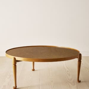 A walnut / burrwood coffee table by Josef Frank