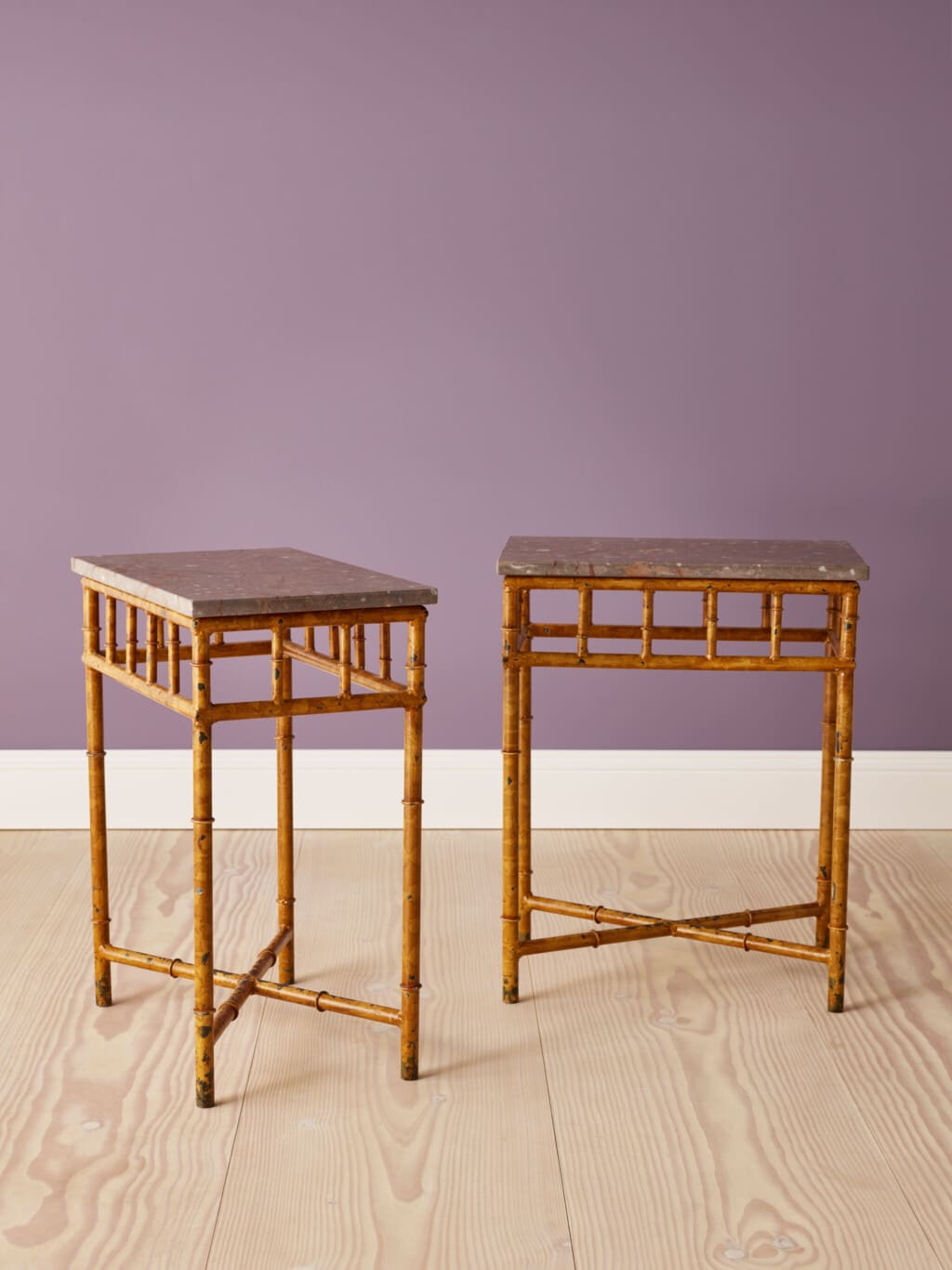 A Pair of side tables in bamboo imitation, painted iron & marble tops