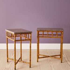 A Pair of side tables in bamboo imitation, painted iron & marble tops