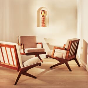 A suite of two armchairs and  sofa in grey velvet mohair fabric