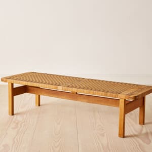 A midcentury bench in oak and rattan by Børge Mogensen