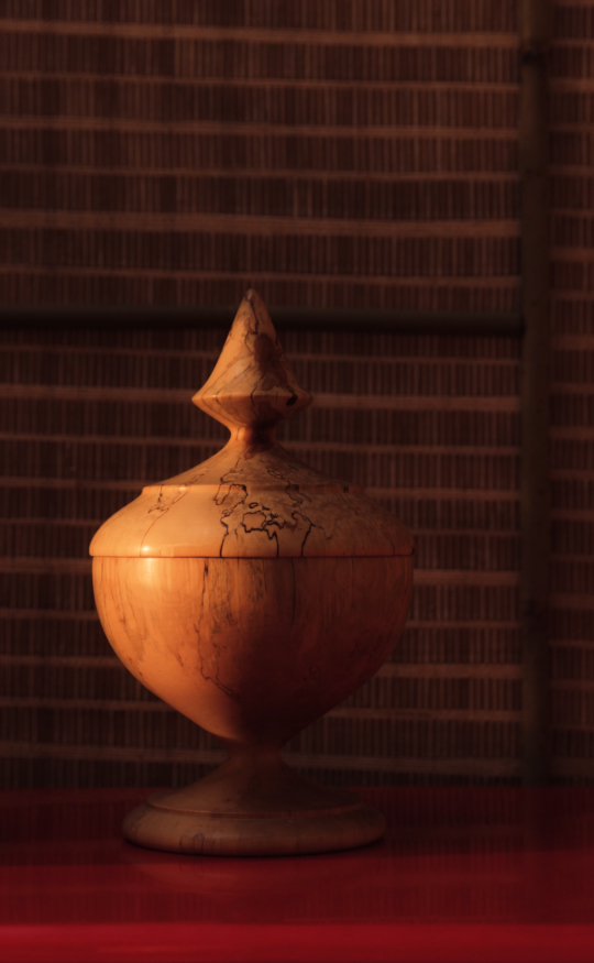 A set of twelve wooden bowls with lids by Oskar Johansson