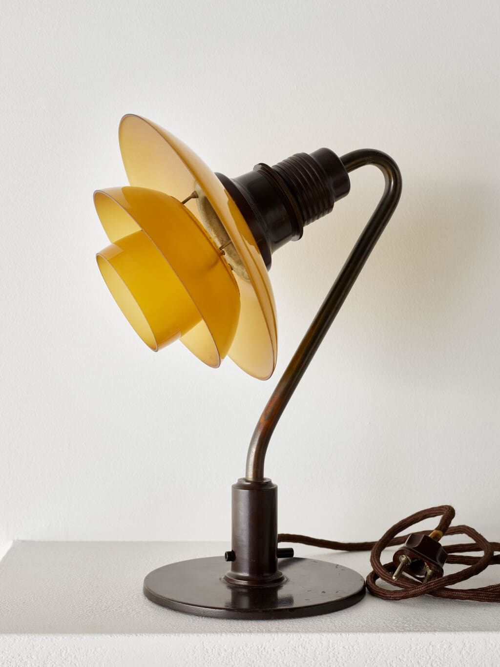 A PH 2/2 patinated brass table lamp, Louis Poulsen
