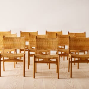 A set of ten oak and rattan 'CH31' chairs by Hans J Wegner