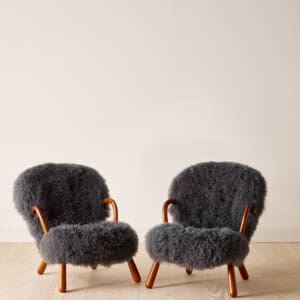 A pair of "Clam" chairs by Philip Arctander in grey long wool sheepskin