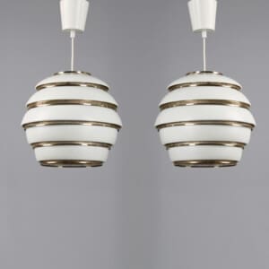 A pair of Alvar Aalto "Beehive" ceiling lamps