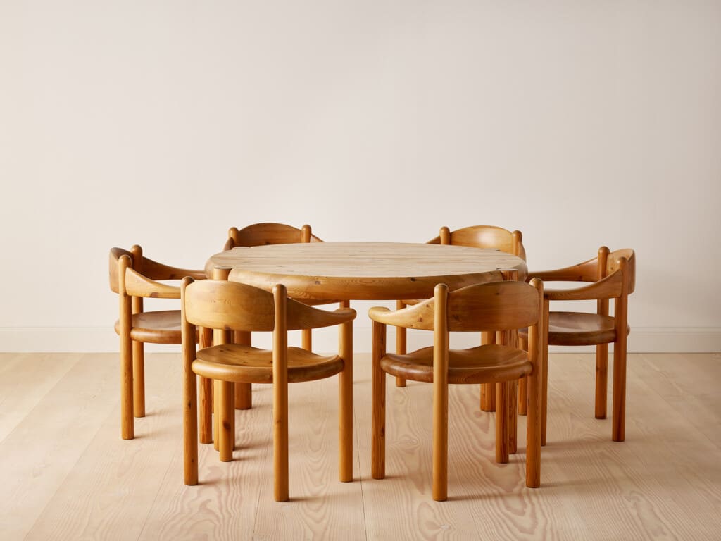 Round pine dining table with eight armchairs by Rainer Daumiller for Hirtshals Savværk. Denmark, 1970s